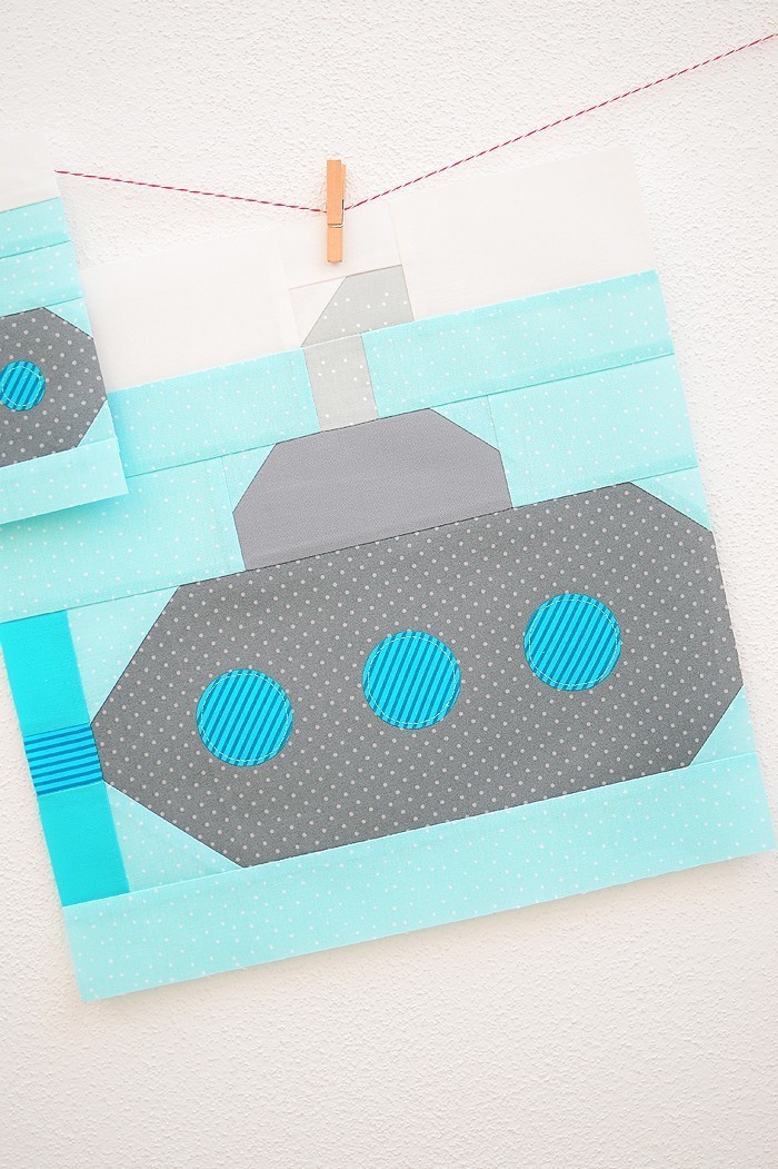 12 Inch Submarine quilt block hanging on a wall