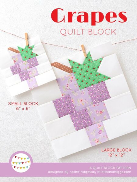 Grapes quilt block in two sizes hanging on a wall