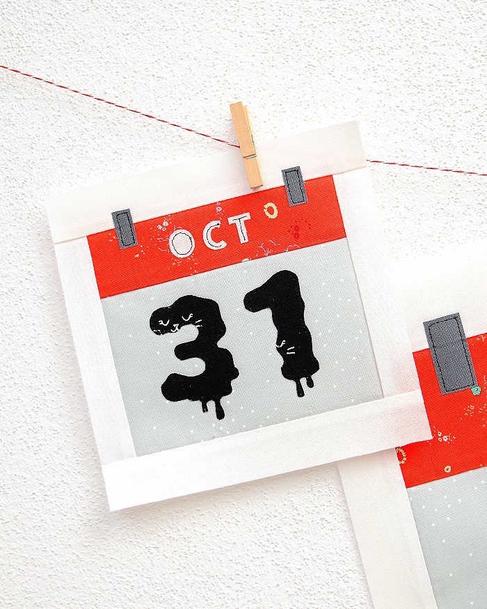 6 Inch Calendar quilt block hanging on a wall