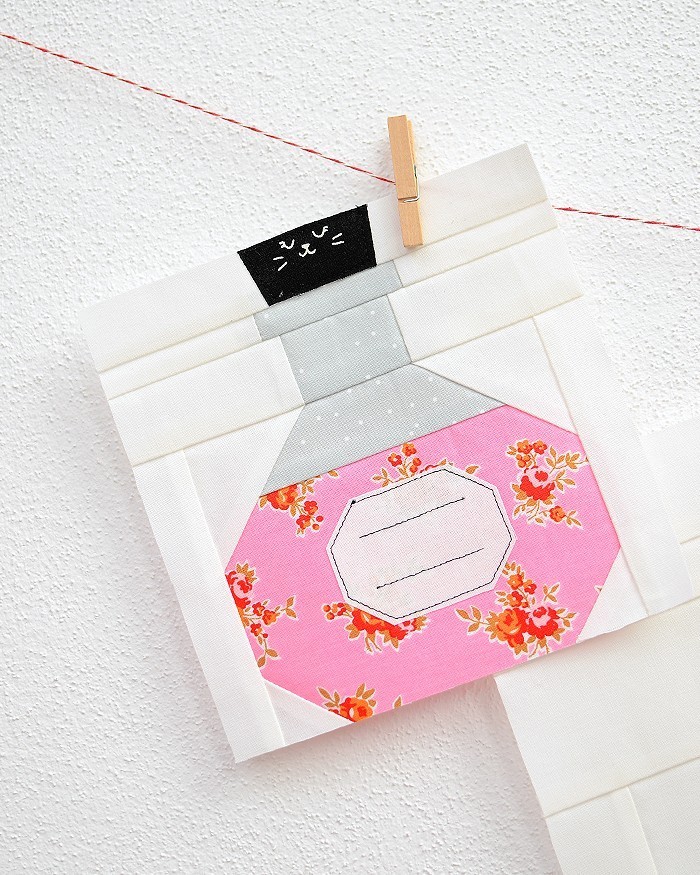 6 Inch Potion Bottle quilt block hanging on a wall