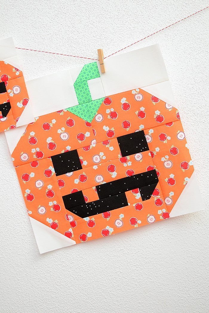 12 Inch Pumpkin quilt block hanging on a wall