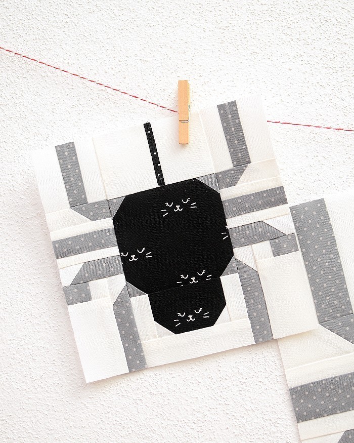 6 Inch Spider quilt block hanging on a wall