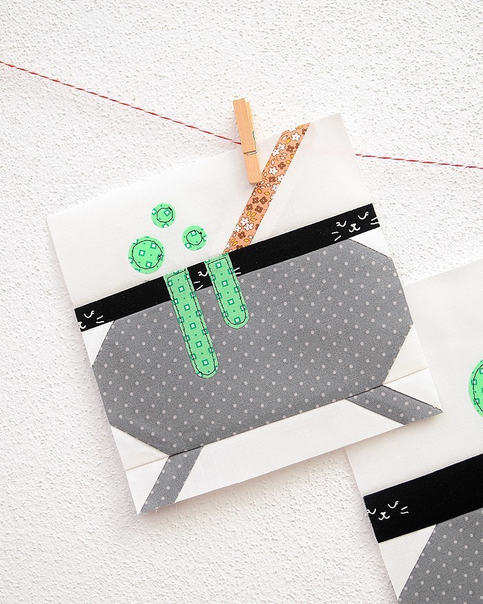 6 Inch Witch Kettle quilt block hanging on a wall