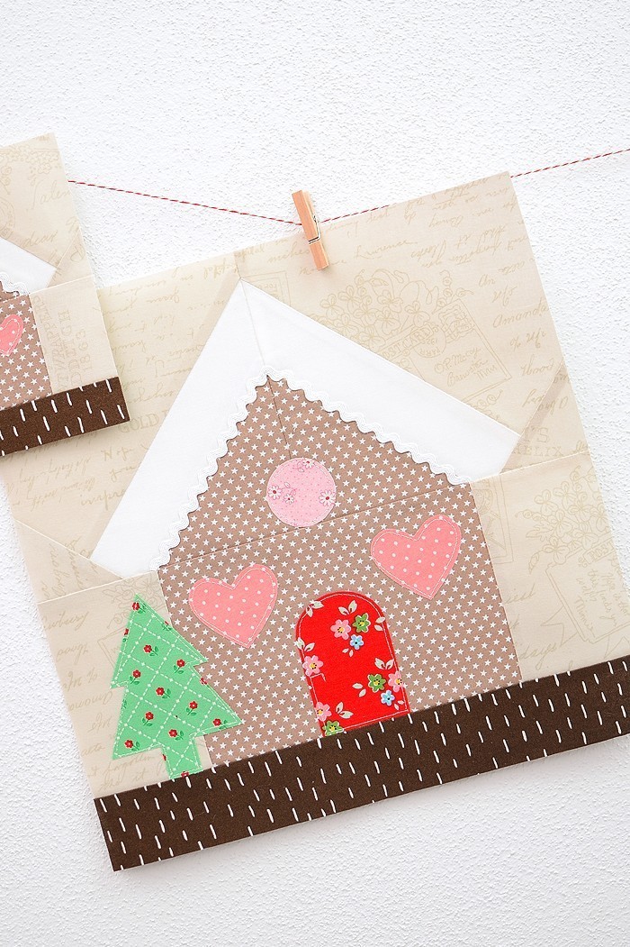 12 Inch Gingerbread House quilt block hanging on a wall