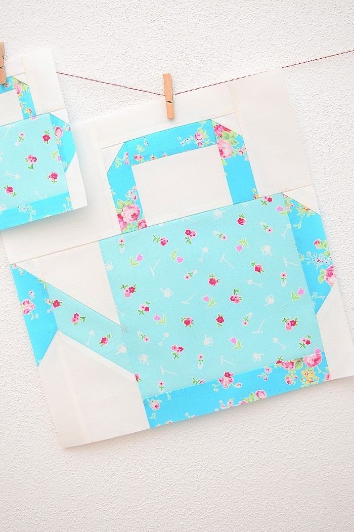 12 Inch Watering Can quilt block hanging on a wall