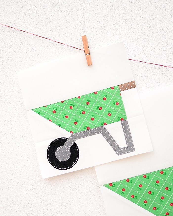 6 Inch Wheelbarrow quilt block hanging on a wall